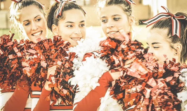 Group of cheerleaders at university sport event show - Concept of unity and team sport with active girls - Training at college high school with young female teenagers - Warm desaturated retro filter — Stock Photo, Image