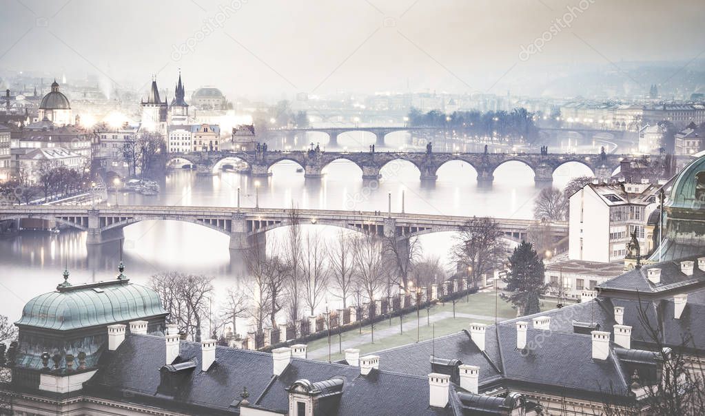 Prague and Vltava river from Letna Hill - Romantic view after misty sunset with emotional foggy atmosphere - European capital of bohemian Czech Republic - Blue cobalt desaturated color filter