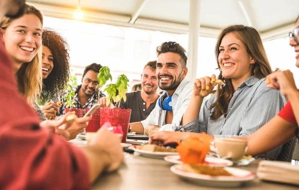 Friends group drinking cappuccino at coffee bar restaurant - People talking and having fun together at fashion cafeteria - Friendship concept with happy men and women at cafe - Warm vintage filter Stok Gambar Bebas Royalti