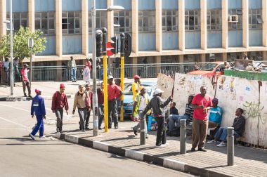 JOHANNESBURG, SOUTH AFRICA - NOVEMBER 13, 2014: everyday life near Gandhi square. After the renovation finished in 2002 the area got a renovated bus terminal , 24-hour security, and many new shops clipart