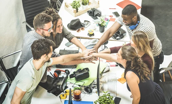 Young employee startup workers group stacking hands at urban studio during entrepreneurship brainstorming project - Business concept of human resources on working time - Start up internship at office — Stock Photo, Image
