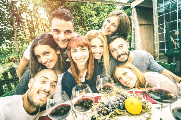 Best friends taking selfie at lunch party with serene faces - Happy youth concept with young people having fun together drinking wine - Cheer and friendship at grape harvest time - Bright retro filter