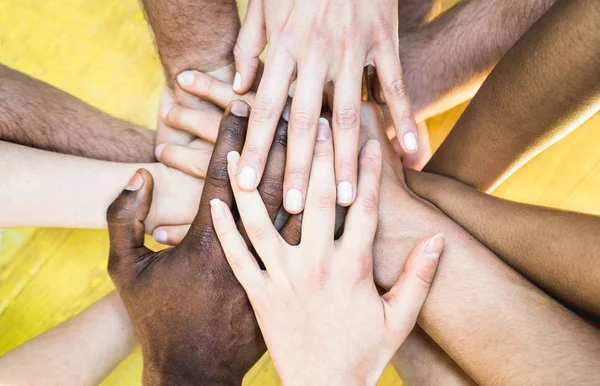 Top view of multiracial stacking hands - International friendship concept with multiethnic people representing peace and unity against racism - Multi racial love and integration between diversity — Stock Photo, Image