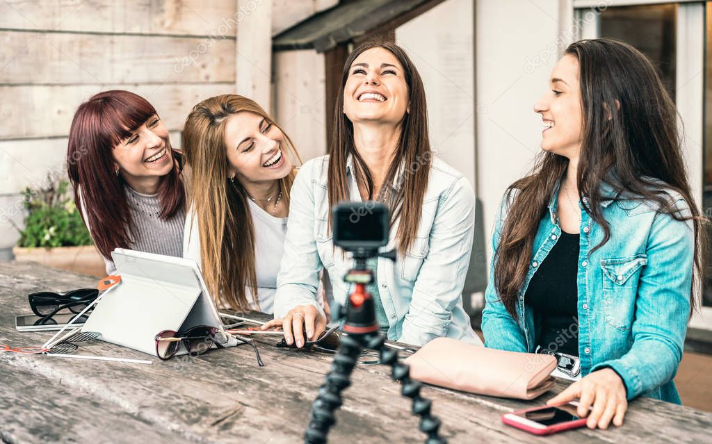 Young millennial women having fun on streaming platform through digital action web cam - Influencer marketing concept with millenial girls sharing content vlogging live feeds on social media networks 