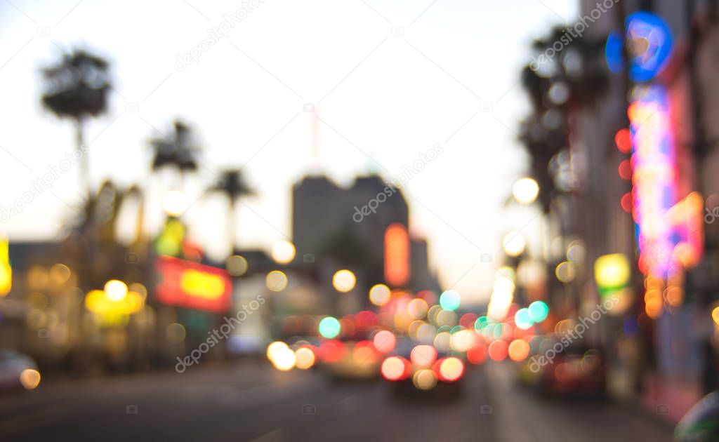 Blurred background of Hollywood Boulevard after sunset -  Defocused view of world famous Walk of Fame in California - United States of America wonder - Warm contrast filter with tilted composition