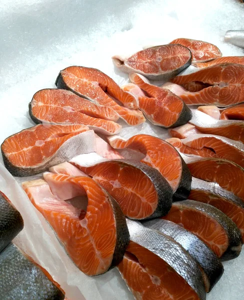 Frozen salmon steaks in ice. Stock Photo