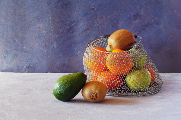 Fruit in a metal basket.