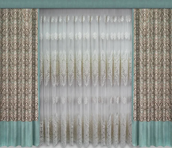 Stylish interior design. Straight curtains with ornament, trimmed with a contrasting green cloth from below and from above, hard pelmet, tulle with a volumetric pattern.