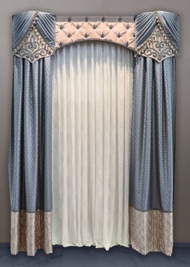 Luxurious interior decoration in the palace style. Double-sided combined curtains in muted tones, light tulle with ornament and original pelmet on a rigid frame. clipart