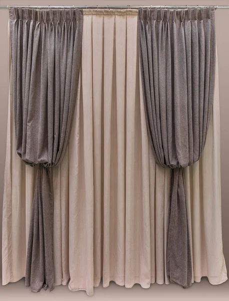 Brown curtains made of woolen fabric, model: "Bishop's sleeve". Tulle from light natural cotton material. Round cornice with rings. The upper edge of the curtain is sewn on a wide blind tape. — Stock Photo, Image
