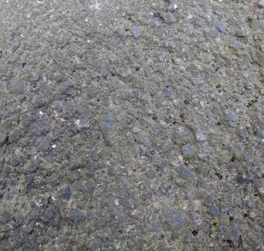 Asfaltın yüzey pürüzü, asfalt gri kumlu yol, doku arkaplan, üst görünüm