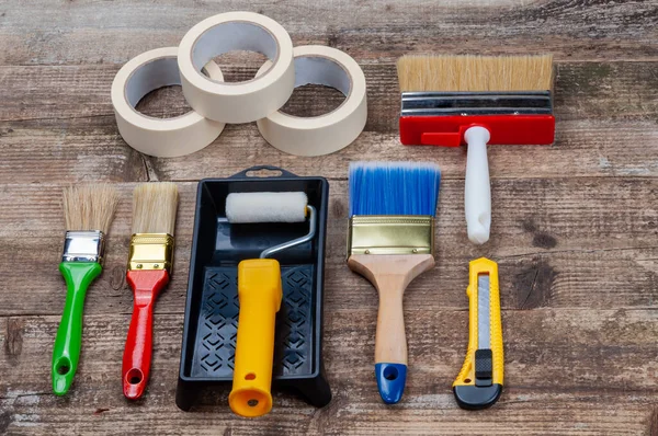 Various Painting Tools Wooden Background Brush Roller Cuvette Duct Tape — Stock Photo, Image