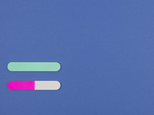 Nail file for nail care on the blue background. The view from the top.