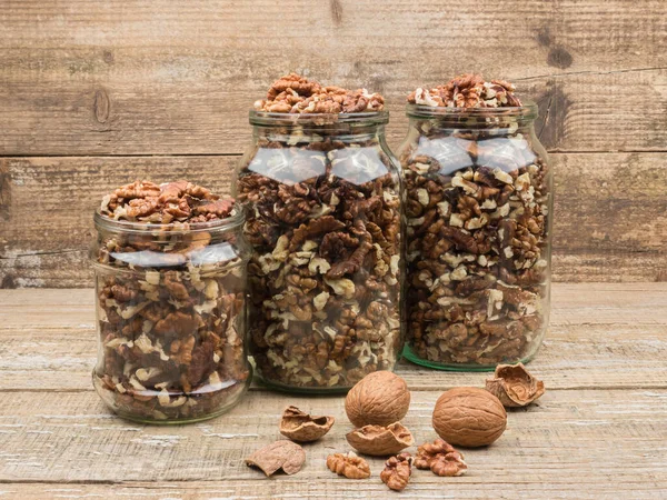 Harvest organic walnuts on wooden background. Close-up. — Stock Photo, Image