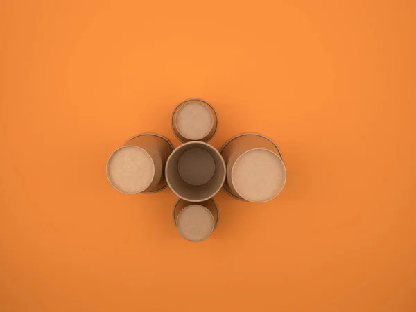 Tazas de papel sobre fondo naranja. Ángulo invertido . —  Fotos de Stock