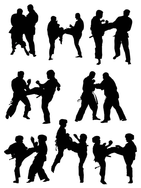 Karate atletlerinin siluetleri vektör — Stok Vektör