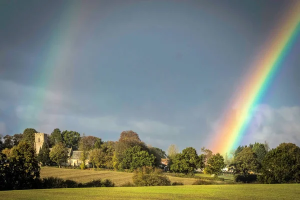 Double rainbow over a church — Stock Photo, Image