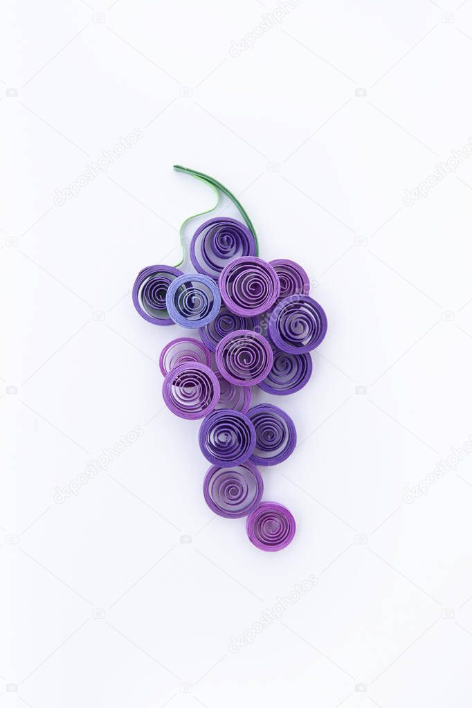 grape over made with quilling technique on white background.