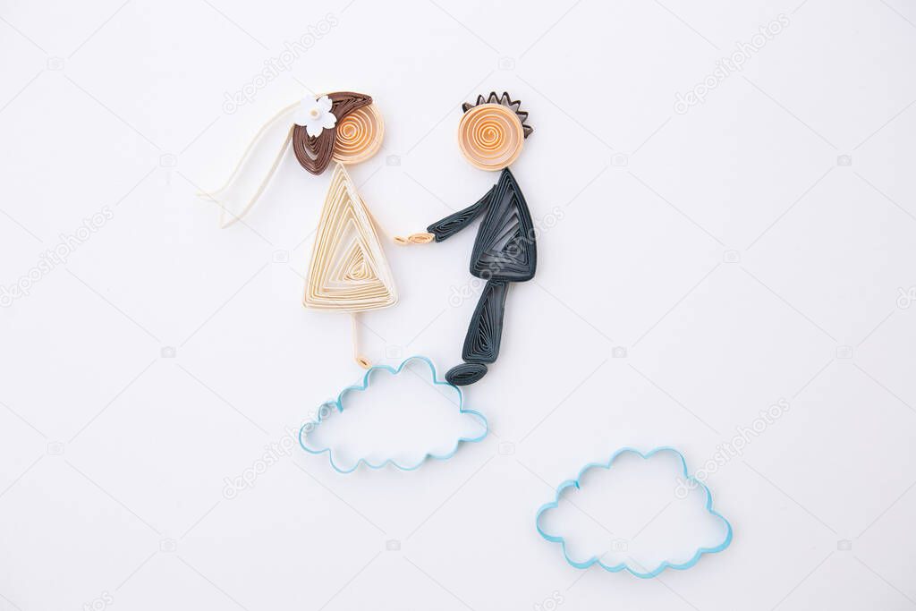 The romantic bridal couple. Hand made of paper quilling technique. Love, wedding concept. Groom and bride.