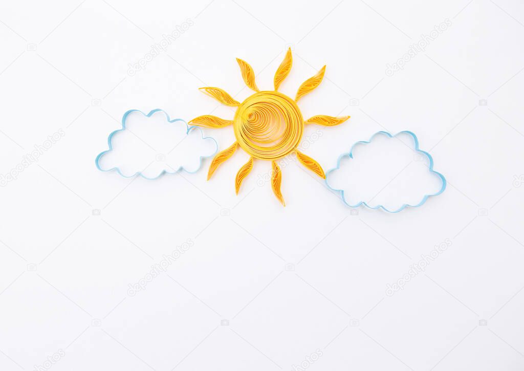 Sun and cloud line isolated on white. Partly cloudy weather. Hand made of paper quilling technique.