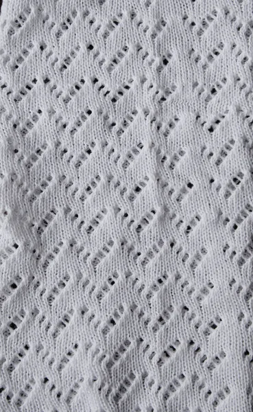 Witte textuur achtergrond van merino gebreide deken, Scandinavische minimalisme achtergrond met kopieerruimte, bovenaanzicht. Abstract breien stof achtergrond. Verticaal concept — Stockfoto