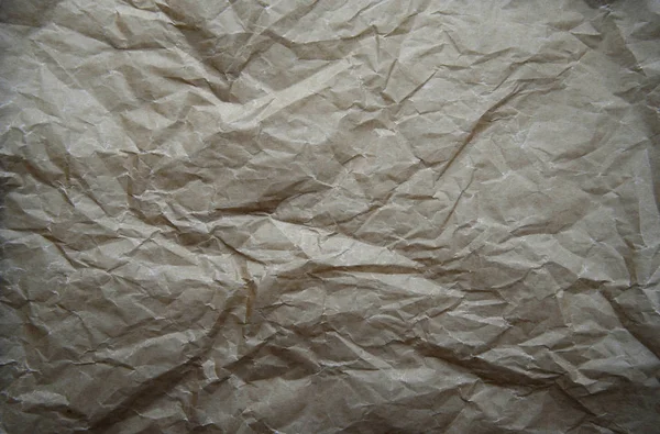 Abstract crumpled baking paper background. Old brown beige Paper textures backgrounds for design, invitation, decorative paper texture concept. Top view — Stock Photo, Image