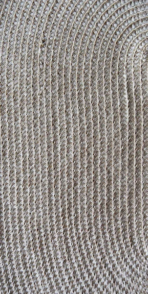 Sombrero de paja textura y patrón. Textura de paja de mimbre fondo de color beige tejiendo macro de primer plano. Lienzo tejido vertical — Foto de Stock