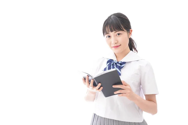 亚洲年轻女子的肖像 穿着校服 手持一本白色背景的书 — 图库照片