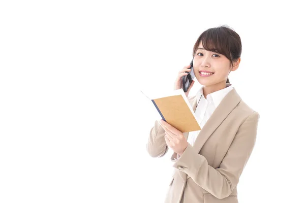 Asian Businesswoman Notebook Talking Mobile Phone Isolated White Background Royalty Free Stock Photos