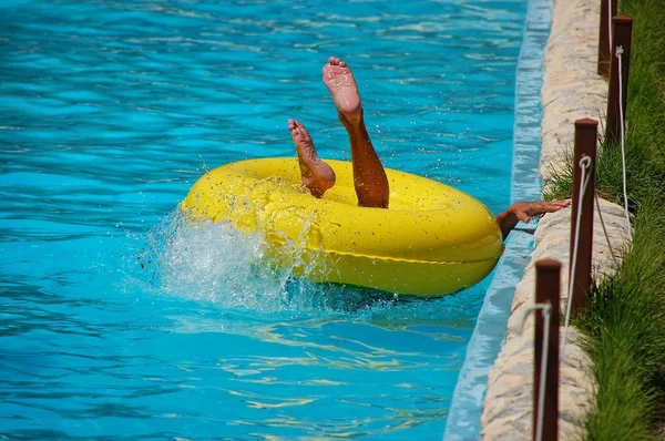 Man in the pool with an inflatable circle — Stock Photo, Image