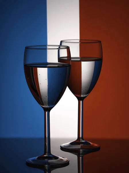 Two wine glasses silhouette full on french flag background. Alcohol beverage. — Stock Photo, Image