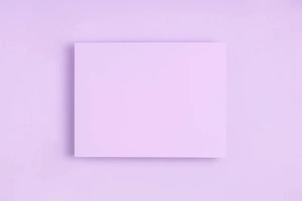 Minimal frame geometric composition mock up. Blank sheet of lilac paper postcard on delicate blue background. Template design invitation card. Top view, flat lay, copy space. Horizontal orientation. — 图库照片