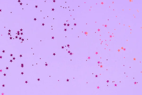 Purple stars glitter confetti on mint background. Festive backdrop. — ストック写真