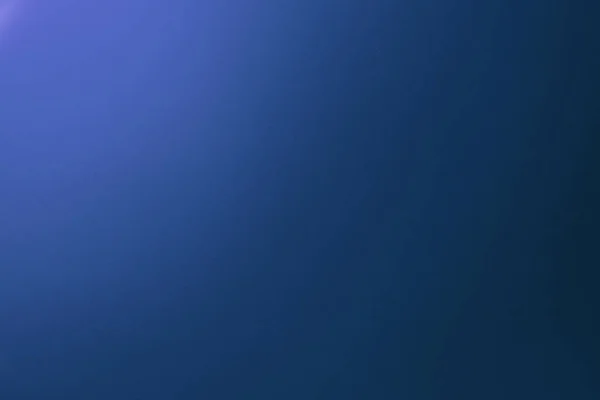 Gradient blue colored paper background.