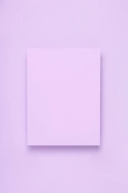 Minimal frame mock up. Blank sheet of lilac paper postcard on delicate lilac background. Template design