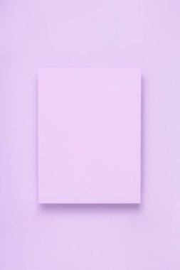 Minimal frame mock up. Blank sheet of lilac paper postcard on delicate lilac background. Template design