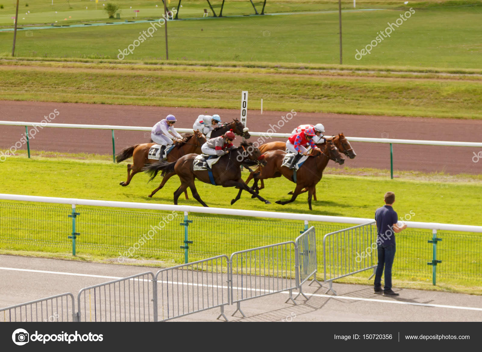 Horses And Riders During Galloping Races At The Racetrack Hippodrome Of France City