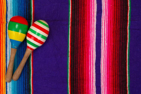 Mexican maraca put on colorful blanket