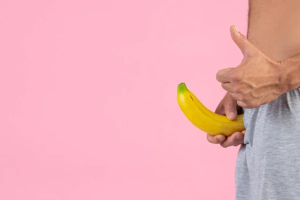 Man Standing Gesture Holding Banana Pink Background — Stock Photo, Image