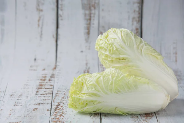 Non-toxic Chinese cabbage on a white wooden background