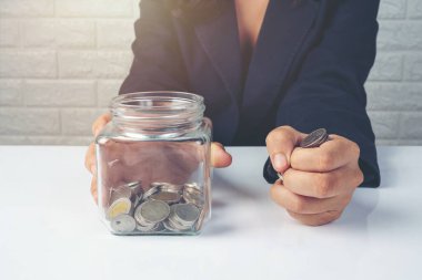 woman employees counting money on a white desk