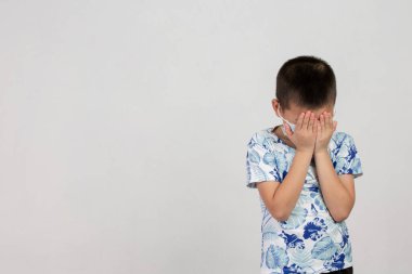 boy with mask acting on white background