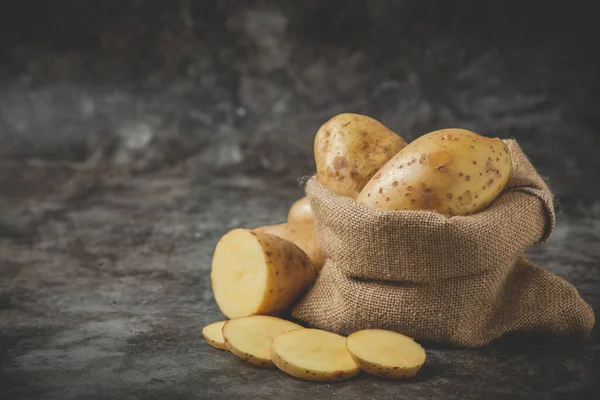 Sliced Potatoes Put Potato Sack Gray Floor — ストック写真