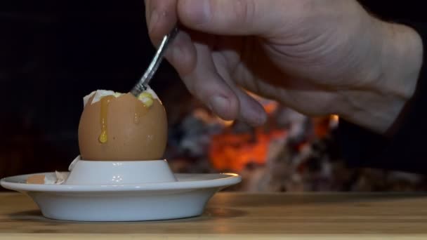 Simple Meal Person Eats Egg Teaspoon Lies Stand Background Fireplace — Stock Video
