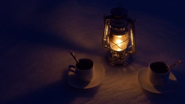 Background Kerosene Lantern Two Cups Coffee Stand Snow Night Close — Stock Video