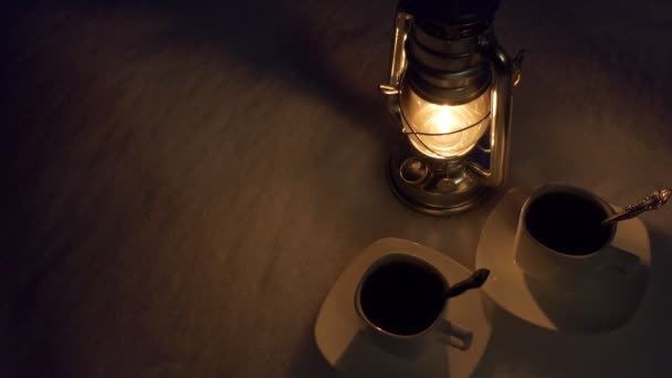 Background Kerosene Lantern Two Cups Coffee Stand Snow Night Close — Stock Video