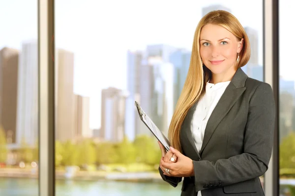 Portrait of business woman standing  near window — Stock Photo, Image