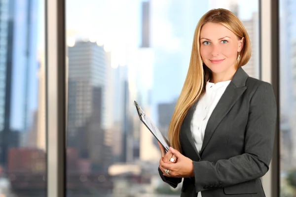 Portrait of business woman standing  near window — Stock Photo, Image
