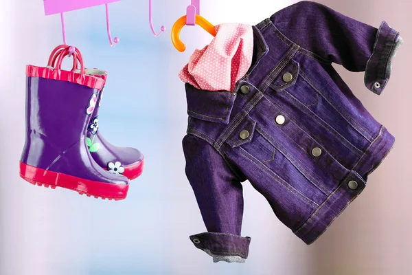 Multi-colored  rubber boots for kids hanging with jeans denim jacket — Stock Photo, Image