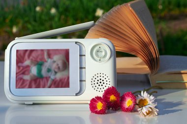 The clouse-up baby monitor for security of the baby  clipart